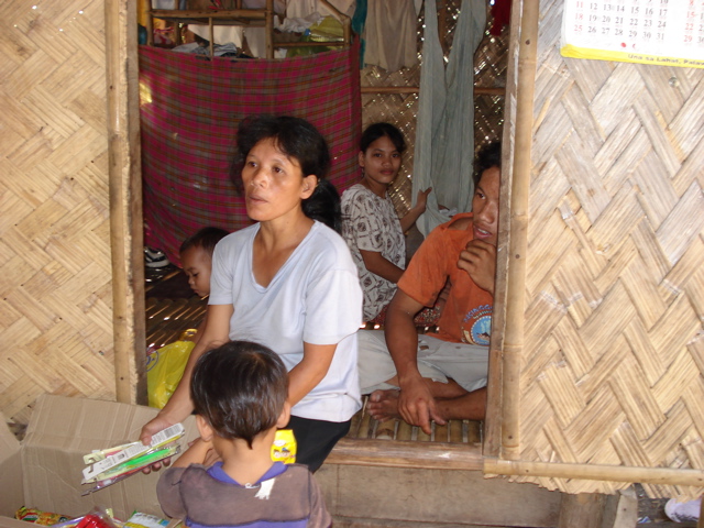 Merly shyly accepts food pack